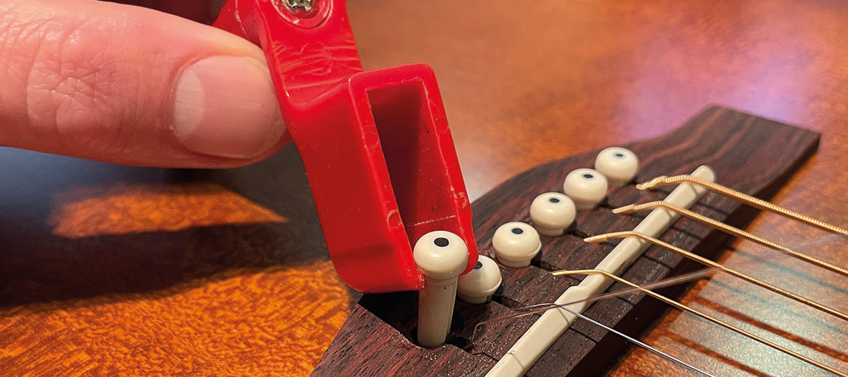 Hoe vervang ik de snaren op mijn akoestische gitaar?